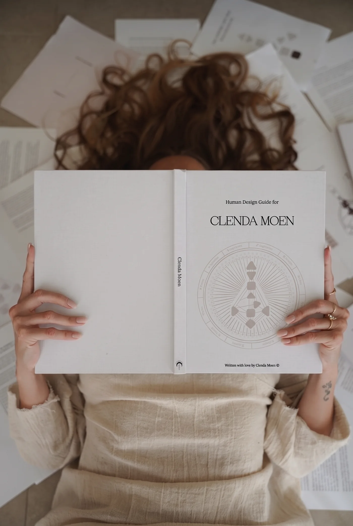 The personalised Human Design Guide, held open